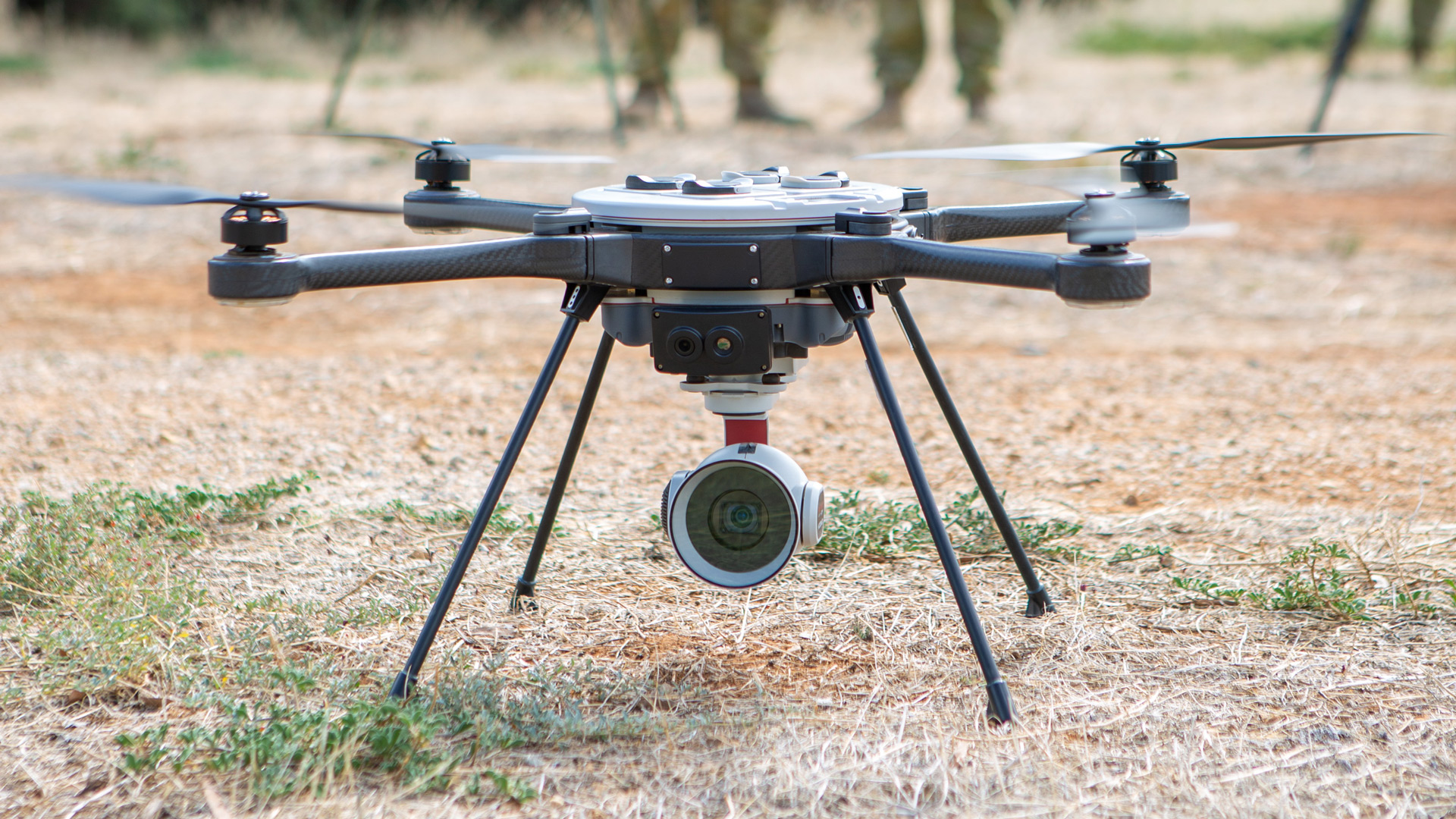 No. 3 Security Forces Squadron members undertake drone training, preparing the Sky Ranger R70 drone for operation from an airborne Royal Australian Air Force C-130J Hercules.